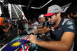 Carlos Sainz Jr., Scuderia Toro Rosso signs autographs for  the fans