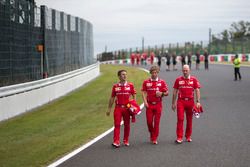 Inaki Rueda, Ferrari Race Strategist, Antti Kontsas, trainer to Sebastian Vettel, Ferrari and Jock Clear, Ferrari Chief Engineer walk the track