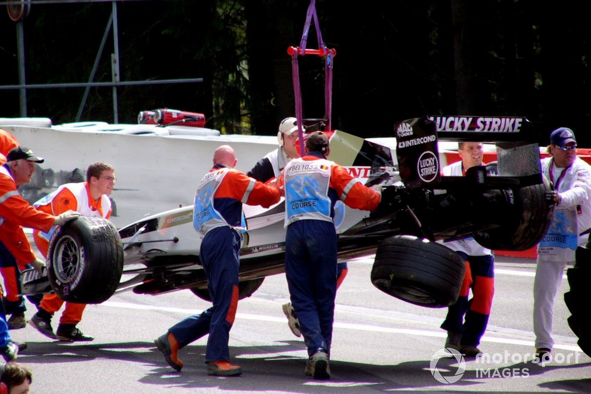 The BAR of Takuma Sato, is removed from the track following a first lap crash