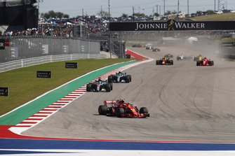 Kimi Raikkonen, Ferrari SF71H, leads Lewis Hamilton, Mercedes AMG F1 W09 EQ Power+, Valtteri Bottas, Mercedes AMG F1 W09 EQ Power+, Daniel Ricciardo, Red Bull Racing RB14, and Sebastian Vettel, Ferrari SF71H, at the start of the race