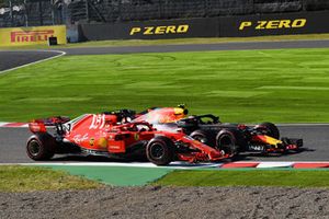 Kimi Raikkonen, Ferrari SF71H and Max Verstappen, Red Bull Racing RB14