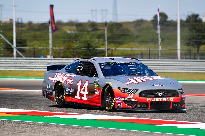 Romain Grosjean, Haas F1 Team, and Kevin Magnussen, Haas F1 Team, ride with Tony Stewart