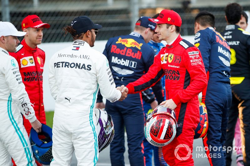 Lewis Hamilton, Mercedes-AMG Petronas F1, shakes hands with Charles Leclerc, Ferrari