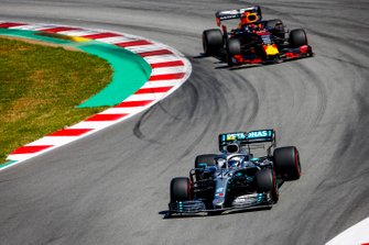 Valtteri Bottas, Mercedes AMG W10, leads Max Verstappen, Red Bull Racing RB15