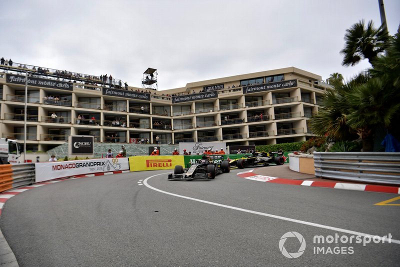 Romain Grosjean, Haas F1 Team VF-19, leads Daniel Ricciardo, Renault R.S.19