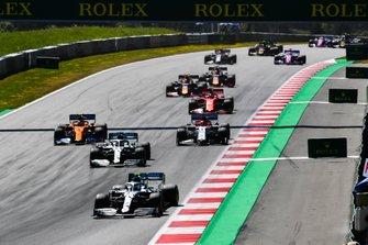 Valtteri Bottas, Mercedes AMG W10, leads Lewis Hamilton, Mercedes AMG F1 W10, Lando Norris, McLaren MCL34, Kimi Raikkonen, Alfa Romeo Racing C38, Sebastian Vettel, Ferrari SF90, Max Verstappen, Red Bull Racing RB15, Pierre Gasly, Red Bull Racing RB15, and the remainder of the field at the start