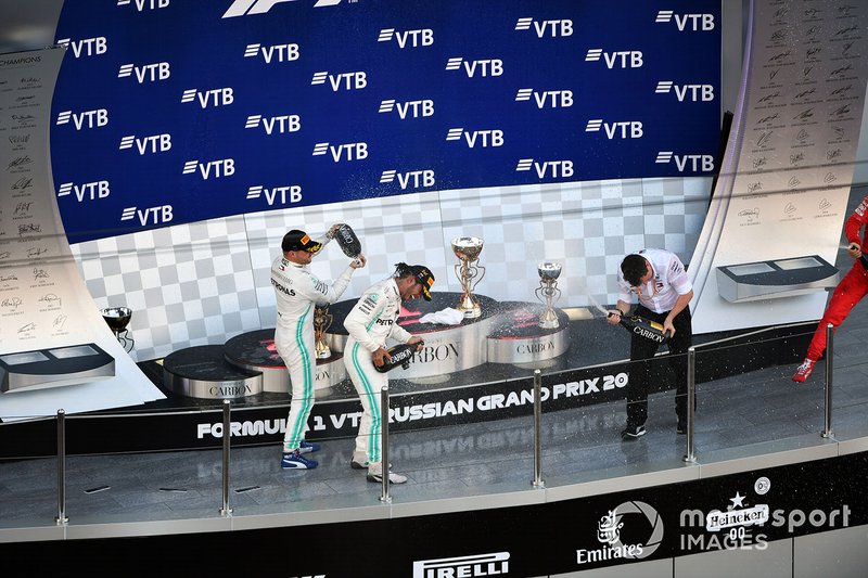 Fred Judd, Chief Engineer Trackside, Mercedes AMG F1, Valtteri Bottas, Mercedes AMG F1, 2nd position, Lewis Hamilton, Mercedes AMG F1, 1st position, and Charles Leclerc, Ferrari, 3rd position, celebrate on the podium