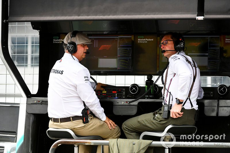 Old fashioned dress adorns Ron Meadows, Sporting Director, Mercedes AMG, and Andrew Shovlin, Chief Race Engineer, Mercedes AMG, on the Mercedes pit wall