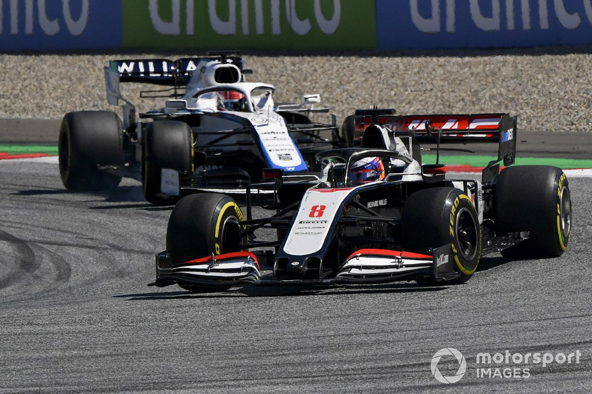 Romain Grosjean, Haas VF-20, leads George Russell, Williams FW43