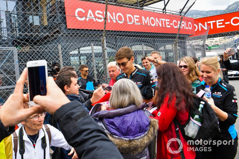 George Rus Williams Racing Signs Autographs Or Fans Whilst George Rus Williams Racing Signs Autographs Or Fans Whilst Walking The Track