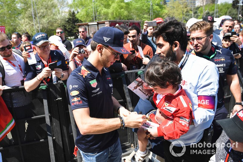 Pierre Gasly, Red Bull Racing signs an autograph for a fan