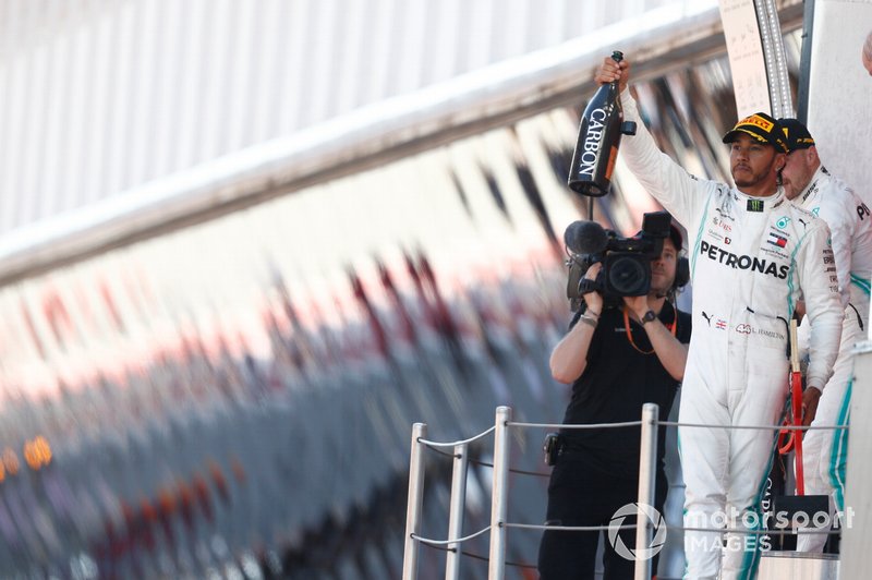 Lewis Hamilton, Mercedes AMG F1, 1st position, with his Champagne
