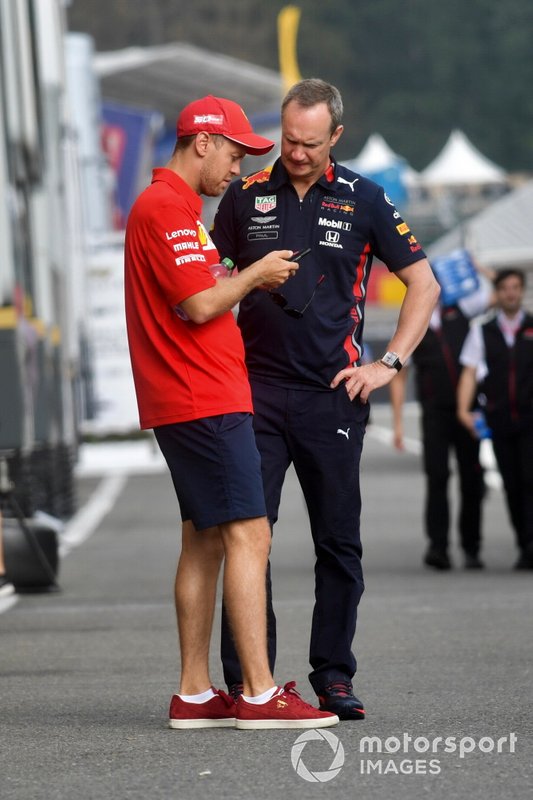 Sebastian Vettel, Ferrari, talks to Paul Monaghan, Chief Engineer, Red Bull Racing