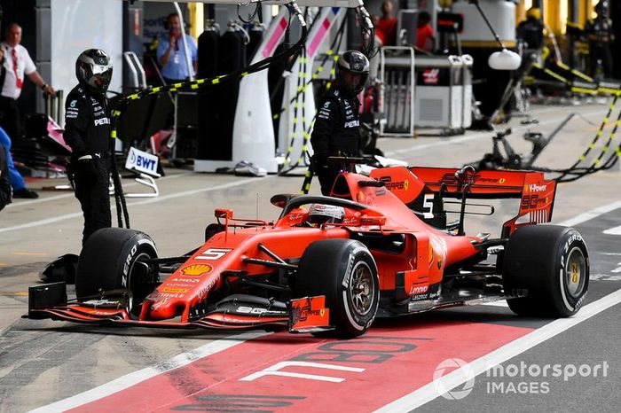 Sebastian Vettel, Ferrari SF90 pit stop for front wing change after contact with Max Verstappen, Red Bull Racing RB15 