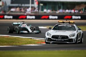 The Safety Car leads Lewis Hamilton, Mercedes AMG F1 W10