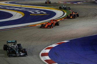 Lewis Hamilton, Mercedes AMG F1 W10, leads Sebastian Vettel, Ferrari SF90, Max Verstappen, Red Bull Racing RB15, and Valtteri Bottas, Mercedes AMG W10