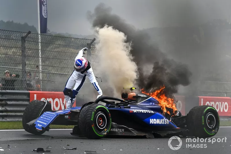 Logan Sargeant, Williams FW46, jumps out of his car after a crash in FP3