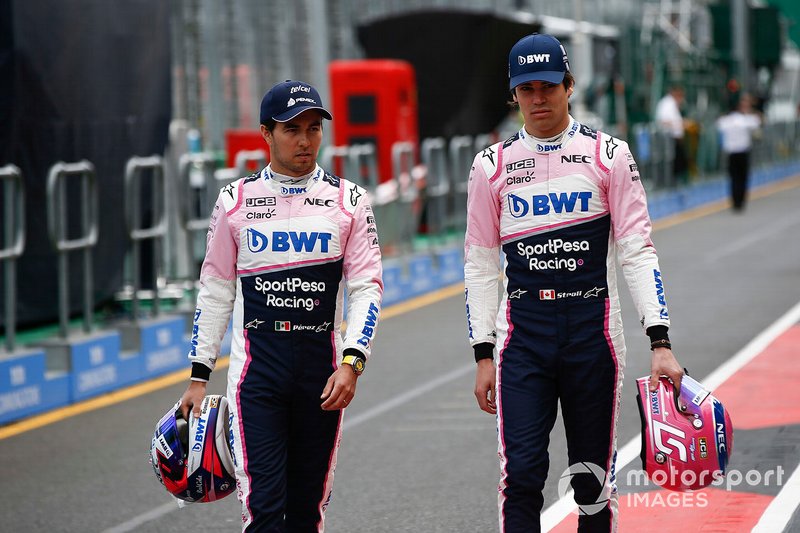 Sergio Perez, Racing Point, and Lance Stroll, Racing Point, in the pits