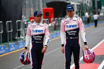 Sergio Perez, Racing Point, and Lance Stroll, Racing Point, in the pits