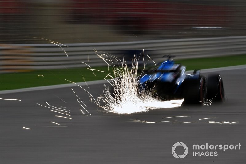 Sparks fly from the rear of George Russell, Williams Racing FW42