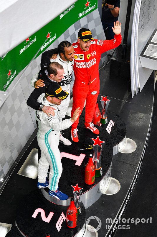 Valtteri Bottas, Mercedes AMG F1, 2nd position, Lewis Hamilton, Mercedes AMG F1, 1st position, and Sebastian Vettel, Ferrari, 3rd position, on the podium