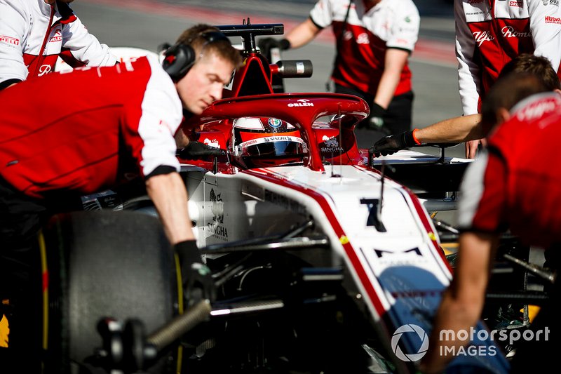 Kimi Raikkonen, Alfa Romeo Racing C39 being pushed by mechanics in the pit lane