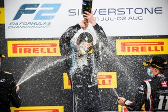 Christian Lundgaard, ART Grand Prix, race Winner Dan Ticktum, Dams and Louis Deletraz, Charouz Racing System celebrate on the podium with the champagne