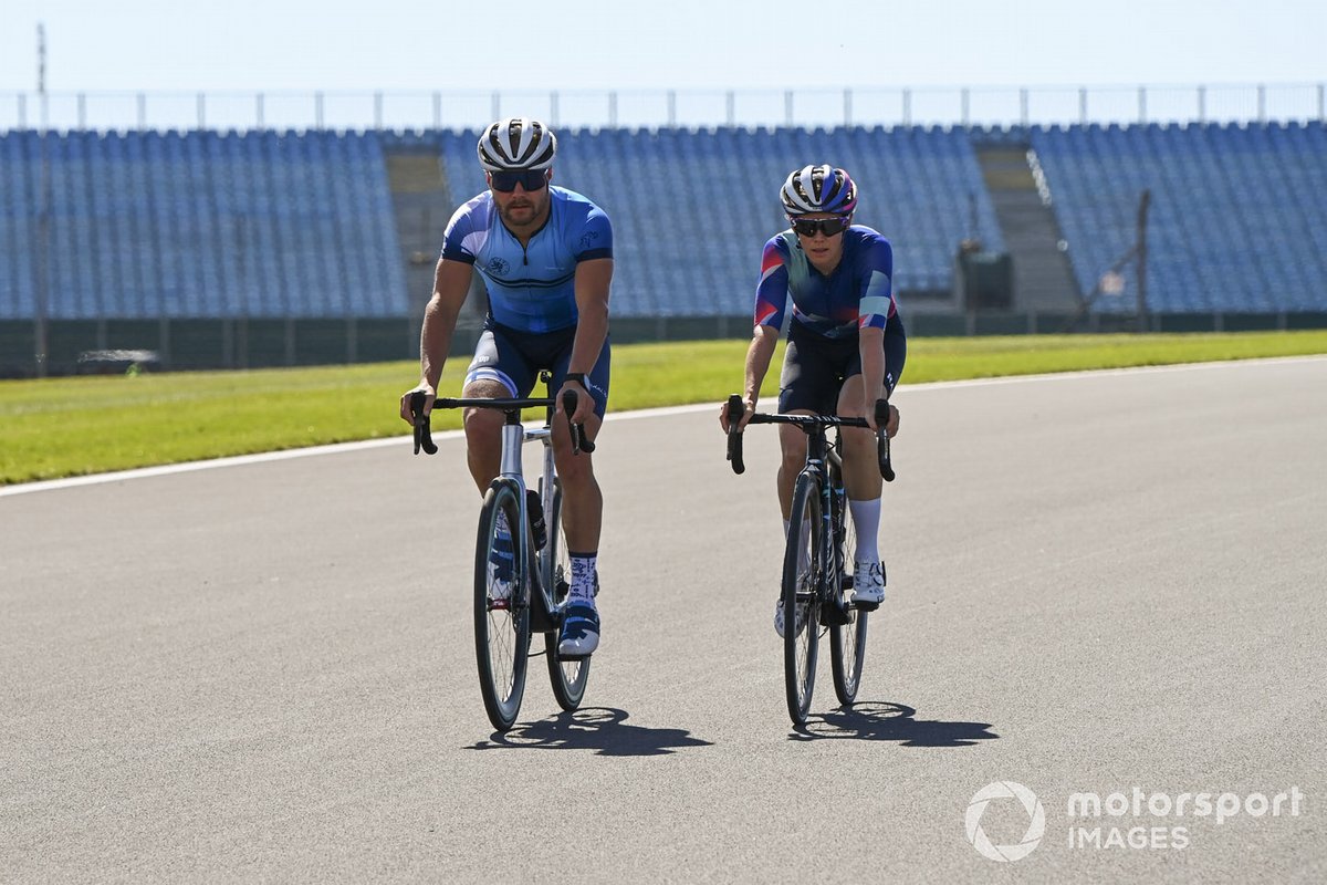 Valtteri Bottas, Mercedes-AMG F1 and Tiffany Cromwell cycle the track