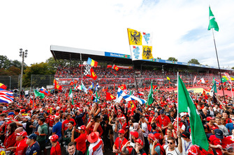 A huge crowd gathers beneath the podium