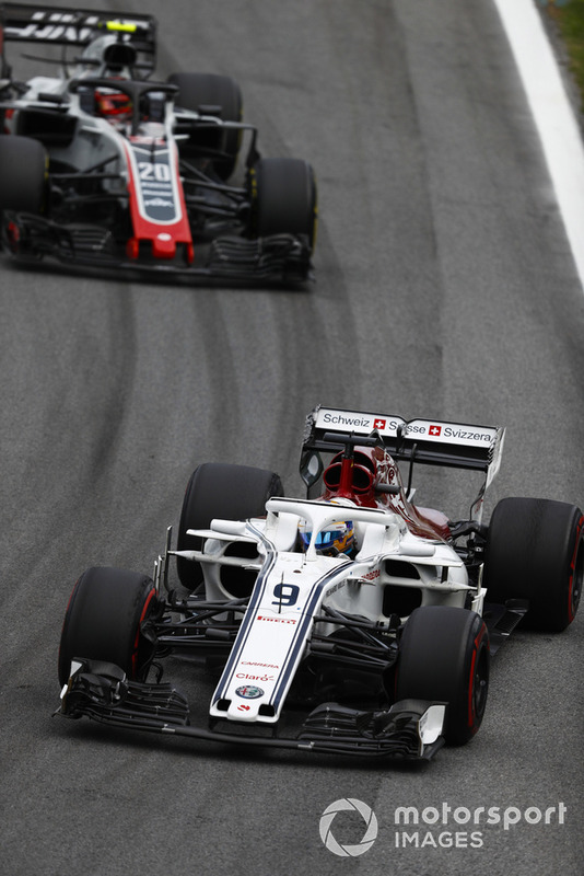 Marcus Ericsson, Sauber C37 Ferrari, leads Kevin Magnussen, Haas F1 Team VF-18 Ferrari.