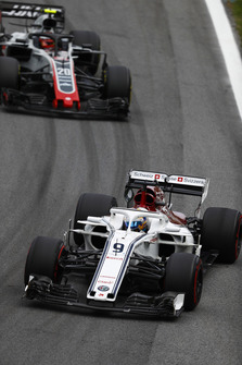 Marcus Ericsson, Sauber C37 Ferrari, leads Kevin Magnussen, Haas F1 Team VF-18 Ferrari.