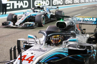 Lewis Hamilton, Mercedes AMG F1 W09 EQ Power+, and Valtteri Bottas, Mercedes AMG F1 W09 EQ Power+, return to the grid after qualifying.