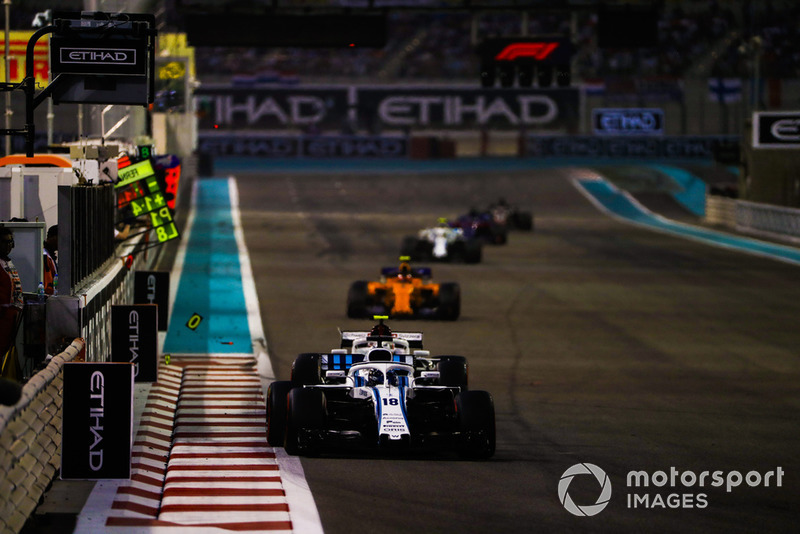 Lance Stroll, Williams FW41, leads Charles Leclerc, Sauber C37, and Stoffel Vandoorne, McLaren MCL33