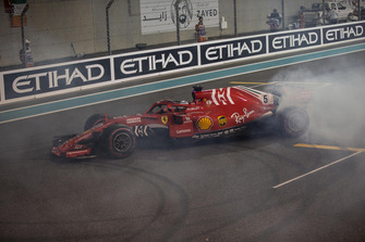 Sebastian Vettel, Ferrari SF71H donuts at the end of the race