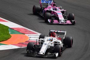 Marcus Ericsson, Sauber C37 leads Sergio Perez, Racing Point Force India VJM11 