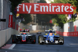 (L to R): Esteban Gutierrez, Haas F1 Team VF-16 and Felipe Nasr, Sauber C35 battle for position