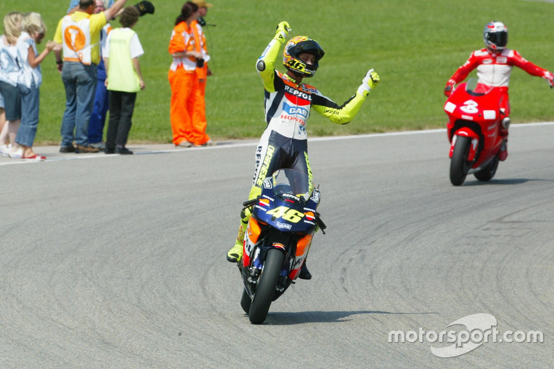 <img src="http://cdn-1.motorsport.com/static/custom/car-thumbs/MOTOGP_2017/RIDERS_NUMBERS/Rossi.png" width="55" /> #21 MotoGP Jerman 2002
