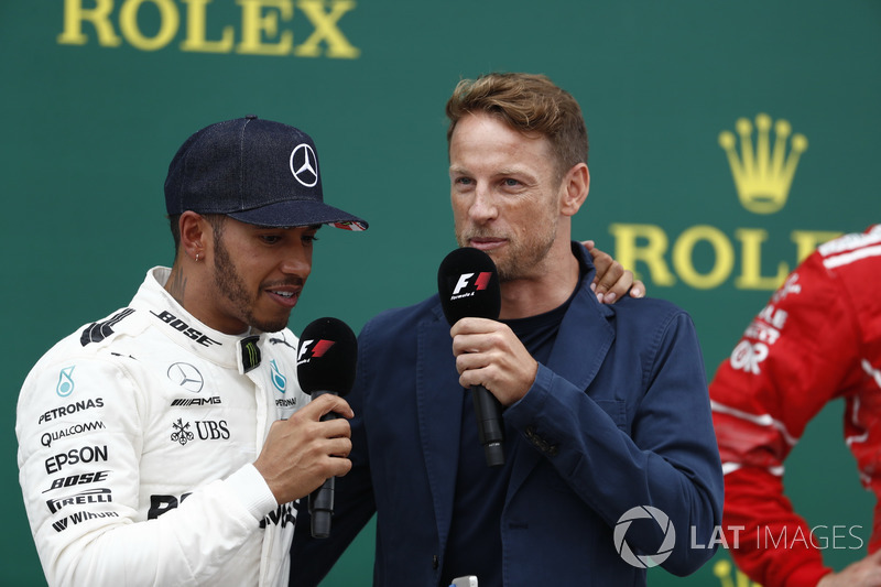 Race winner Lewis Hamilton, Mercedes AMG F1, is interviewed by Jenson Button, McLaren, on the podium