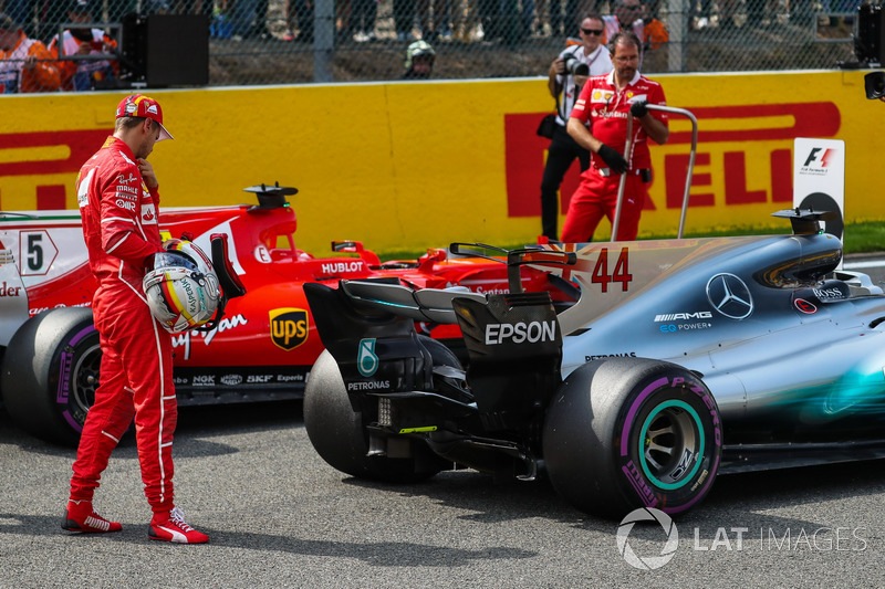 Sebastian Vettel, Ferrari looks at the Mercedes-Benz F1 W08 in parc ferme