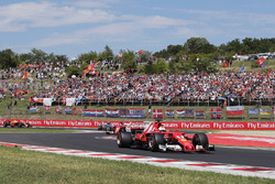 Sebastian Vettel, Ferrari SF70H, leads, Kimi Raikkonen, Ferrari SF70H,