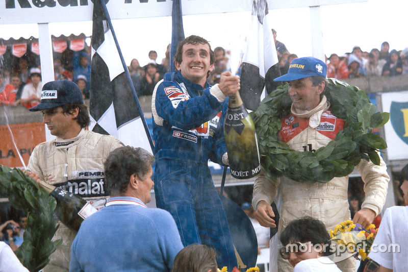 Podium: winner Alain Prost, Renault, second place John Watson, McLaren, third place Nelson Piquet, Brabham