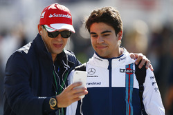 Lance Stroll, Williams, takes a picture with a fan