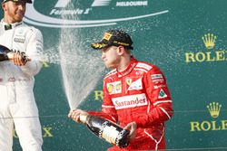 Lewis Hamilton, Mercedes AMG, 2nd Position, and Sebastian Vettel, Ferrari, 1st Position, spray Champ