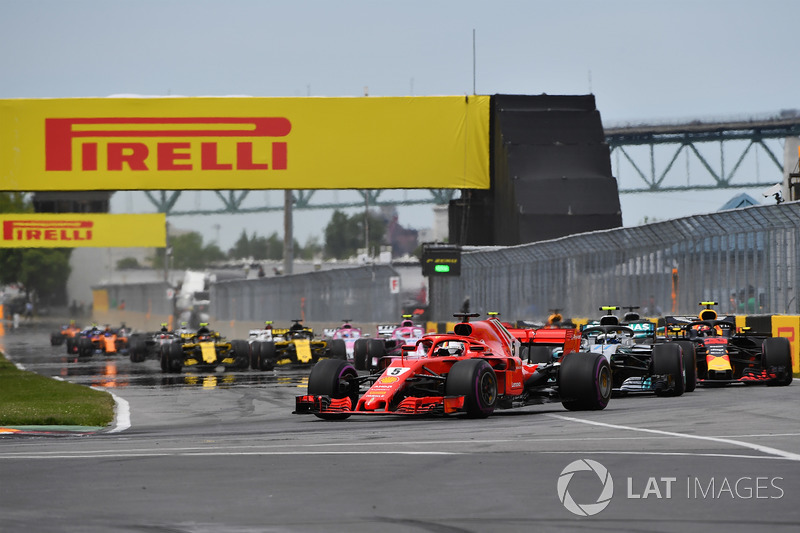 Sebastian Vettel, Ferrari SF71H leads at the start of the race