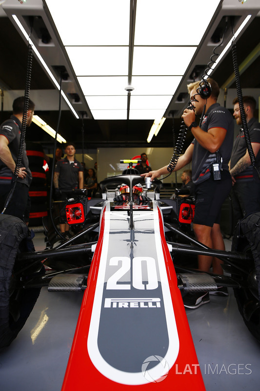 Kevin Magnussen, Haas F1 Team, in cockpit in the team's garage.