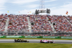 Esteban Ocon, Force India VJM11, leads Carlos Sainz Jr., Renault Sport F1 Team R.S. 18