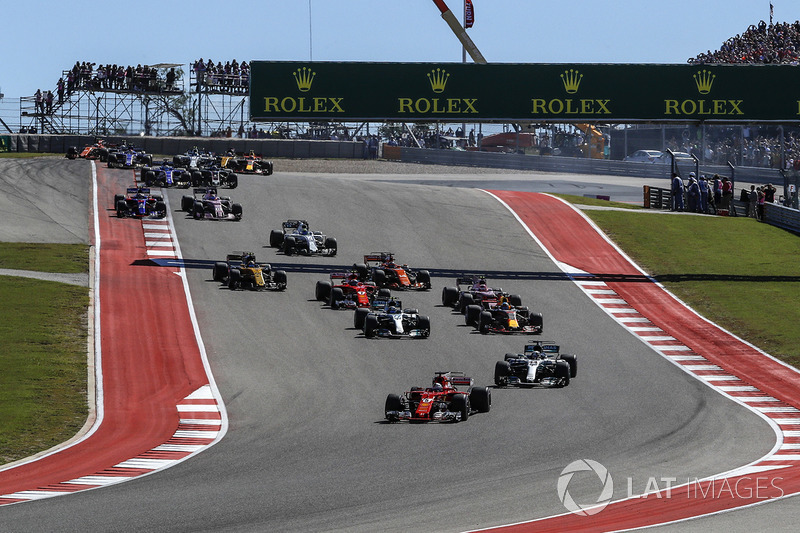 Sebastian Vettel, Ferrari SF70H leads Lewis Hamilton, Mercedes-Benz F1 W08 at the start of the race