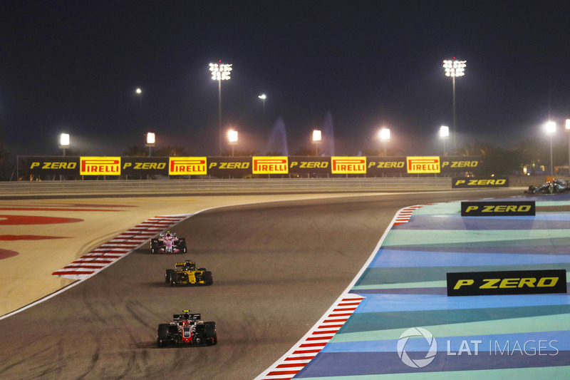 Kevin Magnussen, Haas F1 Team VF-18 Ferrari, leads Nico Hulkenberg, Renault Sport F1 Team R.S. 18, and Esteban Ocon, Force India VJM11 Mercedes