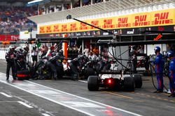 Romain Grosjean, Haas F1 Team VF-18, and Kevin Magnussen, Haas F1 Team VF-18, stack in the pits