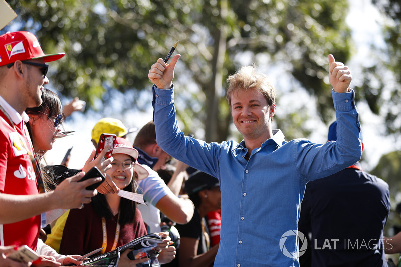 Nico Rosberg signs autographs for fans